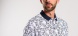 White polo shirt with a bold pattern